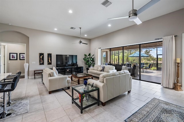32242 Summerglade Dr, Wesley Chapel, FL 33545 - living area with a ceiling fan, recessed lighting, a towering ceiling, and light tile patterned flooring