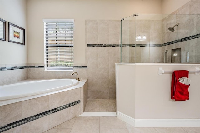 32242 Summerglade Dr, Wesley Chapel, FL 33545 - full bathroom with walk in shower, a garden tub, and tile patterned flooring