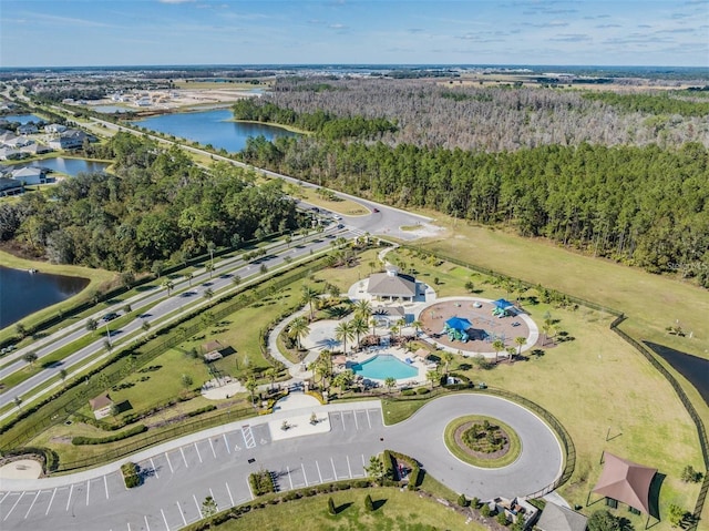 32242 Summerglade Dr, Wesley Chapel, FL 33545 - aerial view of property and surrounding area featuring a nearby body of water, a heavily wooded area, and a pool area