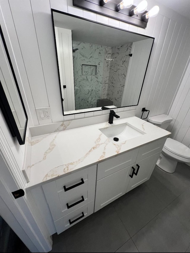 2424 W Tampa Bay Blvd Unit 203, Tampa, FL 33607 - full bathroom featuring toilet, a walk in shower, vanity, and tile patterned floors