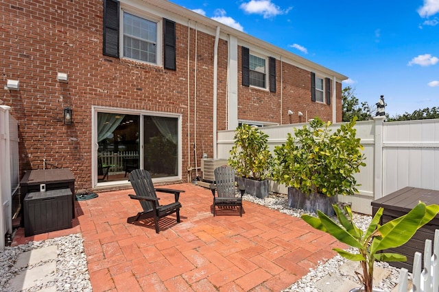 view of patio / terrace featuring fence and cooling unit