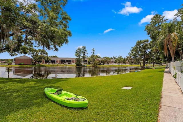 surrounding community with a water view