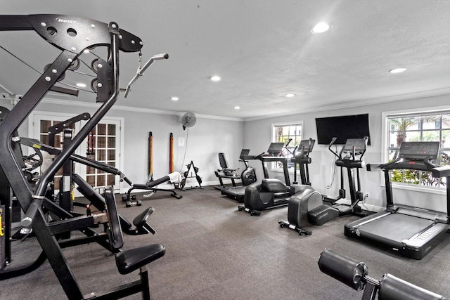 gym featuring ornamental molding, recessed lighting, plenty of natural light, and baseboards
