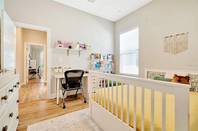 4093 Epic Cv, Land O Lakes, FL 34638 - bedroom with light wood-style flooring, a desk, and baseboards