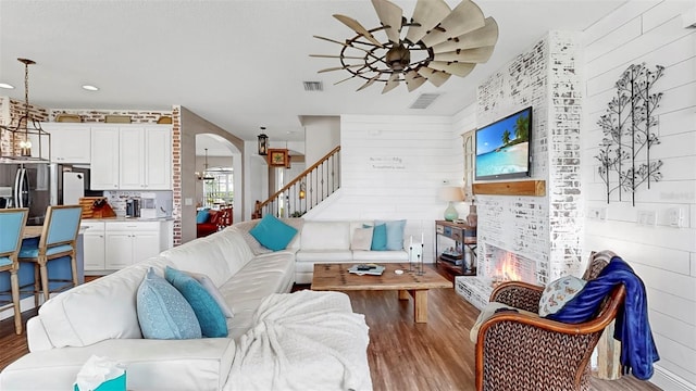 5040 Inshore Landing Dr, Apollo Beach, FL 33572 - living room with ceiling fan, wood finished floors, arched walkways, stairway, and recessed lighting