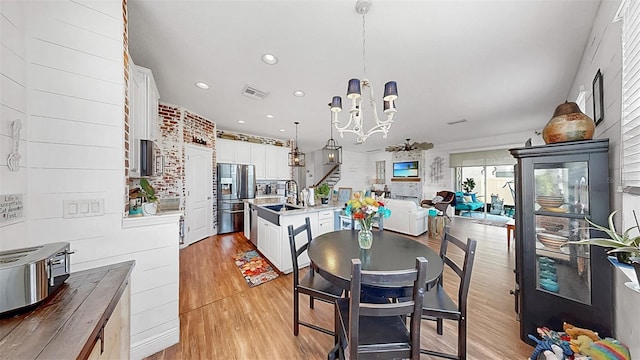 5040 Inshore Landing Dr, Apollo Beach, FL 33572 - dining area with a chandelier, light wood finished floors, and recessed lighting