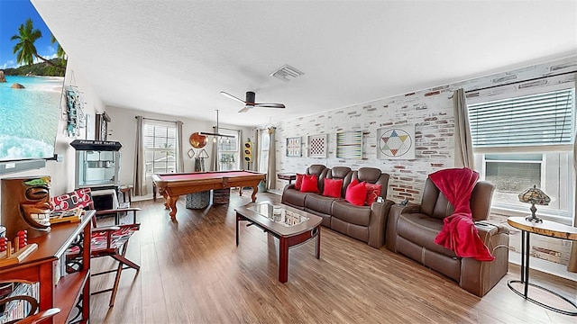 5040 Inshore Landing Dr, Apollo Beach, FL 33572 - living room featuring pool table, wood finished floors, ceiling fan, and a textured ceiling
