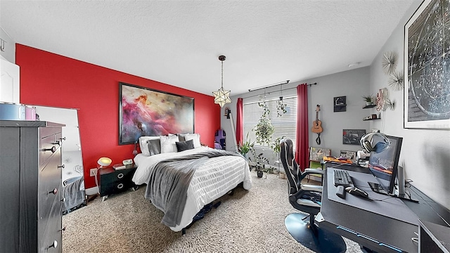 5040 Inshore Landing Dr, Apollo Beach, FL 33572 - bedroom featuring an accent wall, a desk, carpet flooring, and a textured ceiling