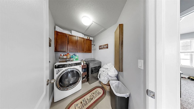 5040 Inshore Landing Dr, Apollo Beach, FL 33572 - laundry area with washer / clothes dryer, cabinet space, and a textured ceiling