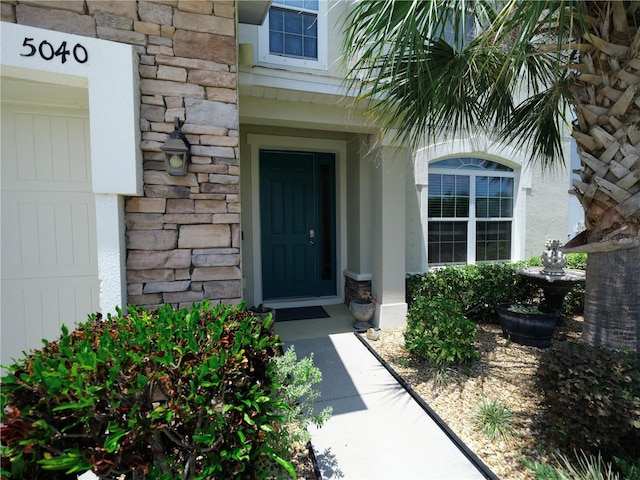 5040 Inshore Landing Dr, Apollo Beach, FL 33572 - view of exterior entry with stone siding