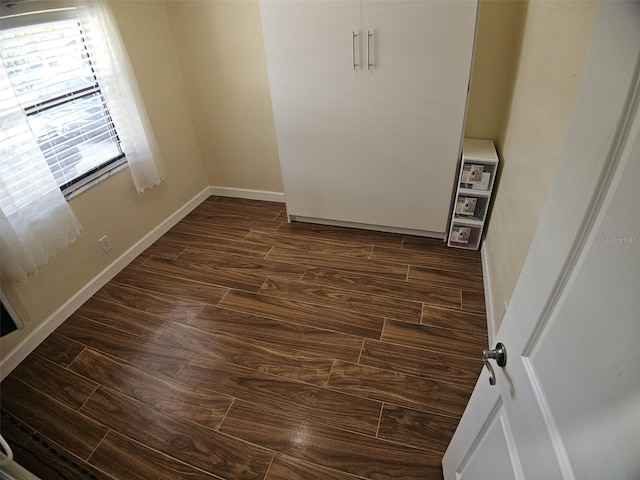 10003 Winding Lake Rd Unit 105, Sunrise, FL 33351 - empty room featuring dark wood-type flooring and baseboards