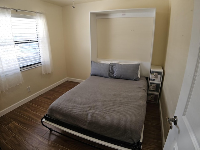 10003 Winding Lake Rd Unit 105, Sunrise, FL 33351 - bedroom with wood finished floors and baseboards