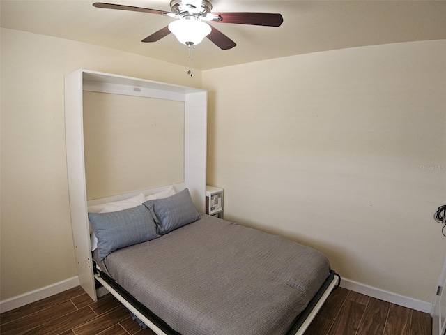 10003 Winding Lake Rd Unit 105, Sunrise, FL 33351 - bedroom featuring wood finished floors, baseboards, and ceiling fan