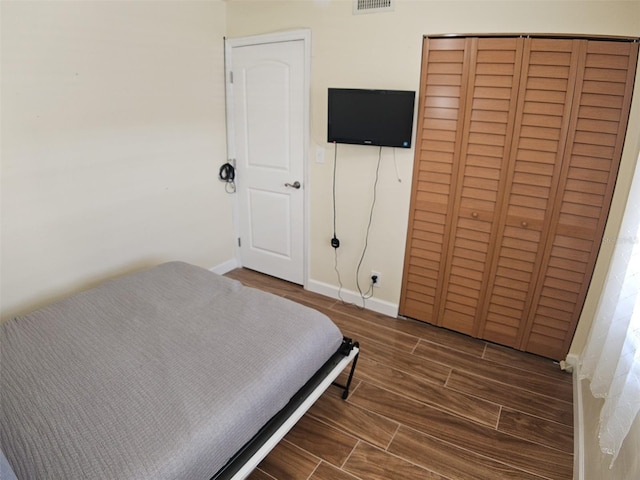 10003 Winding Lake Rd Unit 105, Sunrise, FL 33351 - bedroom featuring wood finished floors, baseboards, and a closet