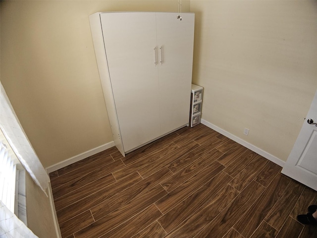 10003 Winding Lake Rd Unit 105, Sunrise, FL 33351 - washroom featuring baseboards and dark wood finished floors