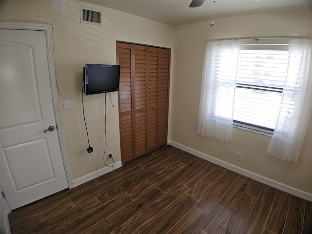 10003 Winding Lake Rd Unit 105, Sunrise, FL 33351 - unfurnished bedroom with wood tiled floors, a closet, baseboards, and ceiling fan