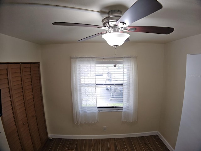 10003 Winding Lake Rd Unit 105, Sunrise, FL 33351 - unfurnished bedroom with multiple windows, wood finished floors, and baseboards