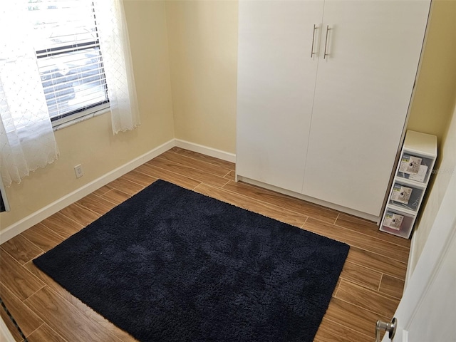 10003 Winding Lake Rd Unit 105, Sunrise, FL 33351 - unfurnished bedroom with light wood-style flooring and baseboards