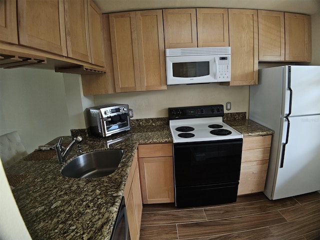 10003 Winding Lake Rd Unit 105, Sunrise, FL 33351 - kitchen with white appliances, a sink, wood finish floors, and dark stone counters