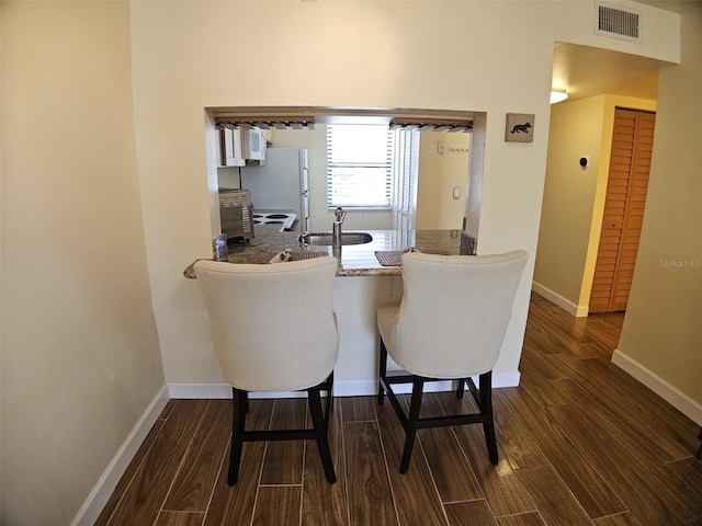 10003 Winding Lake Rd Unit 105, Sunrise, FL 33351 - dining space with wood finished floors and baseboards