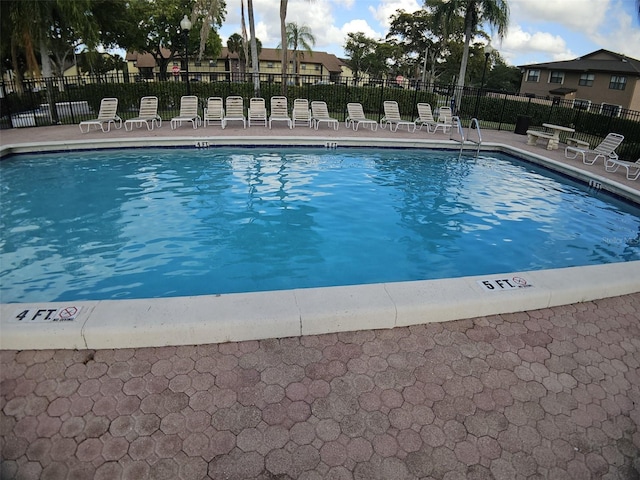 10003 Winding Lake Rd Unit 105, Sunrise, FL 33351 - community pool featuring fence and a patio