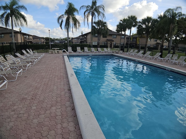 10003 Winding Lake Rd Unit 105, Sunrise, FL 33351 - community pool featuring fence and a residential view