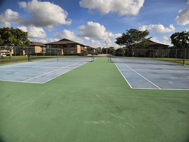 10003 Winding Lake Rd Unit 105, Sunrise, FL 33351 - view of tennis court with fence and community basketball court