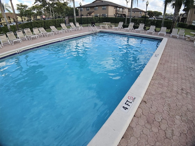 10003 Winding Lake Rd Unit 105, Sunrise, FL 33351 - community pool with fence and a patio area