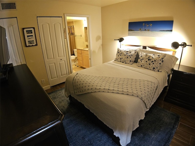 10003 Winding Lake Rd Unit 105, Sunrise, FL 33351 - bedroom featuring wood finished floors and ensuite bath
