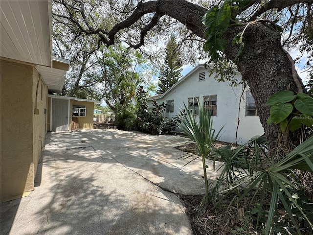1536 S Martin Luther King Jr Ave, Clearwater, FL 33756 - view of patio / terrace with fence and concrete driveway