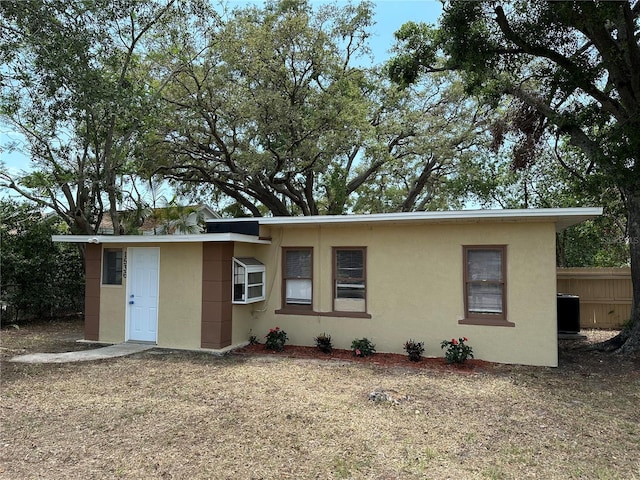 1536 S Martin Luther King Jr Ave, Clearwater, FL 33756 - view of front of house featuring stucco siding and central AC