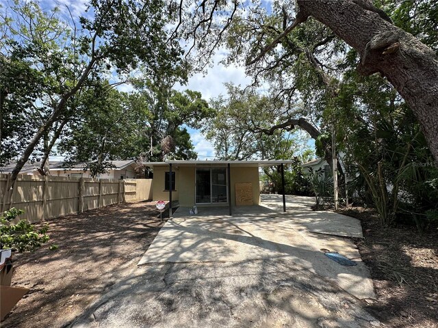 1536 S Martin Luther King Jr Ave, Clearwater, FL 33756 - back of house featuring stucco siding and a patio