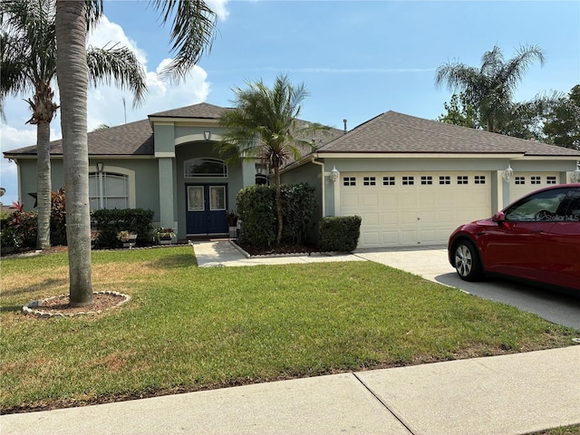 4512 River Overlook Dr, Valrico, FL 33596 - view of front facade featuring an attached garage, driveway, stucco siding, a front lawn, and roof with shingles