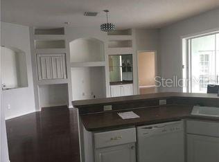 4512 River Overlook Dr, Valrico, FL 33596 - kitchen with white dishwasher and dark countertops