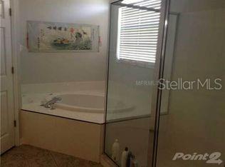4512 River Overlook Dr, Valrico, FL 33596 - full bath featuring a garden tub and a stall shower