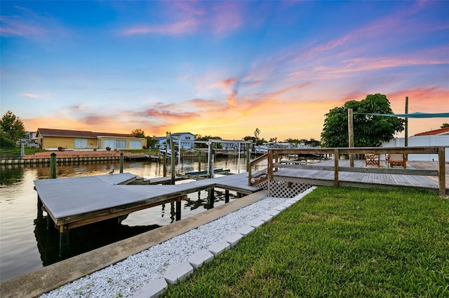 3912 Doral Dr, Tampa, FL 33634 - dock area with a water view, a yard, and boat lift