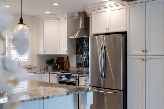 3912 Doral Dr, Tampa, FL 33634 - kitchen featuring appliances with stainless steel finishes, wall chimney exhaust hood, white cabinets, and recessed lighting