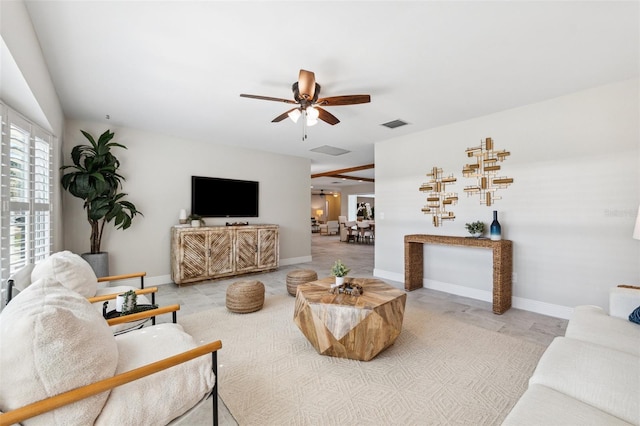 3912 Doral Dr, Tampa, FL 33634 - tiled living area with ceiling fan and baseboards
