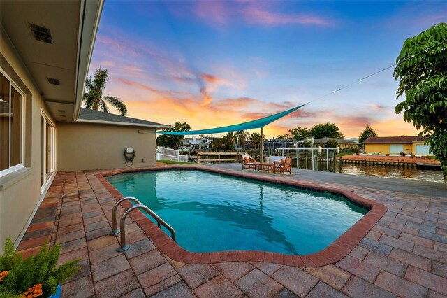 3912 Doral Dr, Tampa, FL 33634 - view of swimming pool featuring a patio