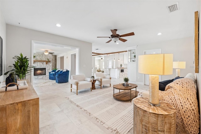 3912 Doral Dr, Tampa, FL 33634 - living room featuring a ceiling fan, a large fireplace, and recessed lighting