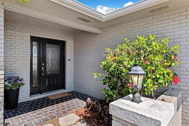 3912 Doral Dr, Tampa, FL 33634 - doorway to property with brick siding