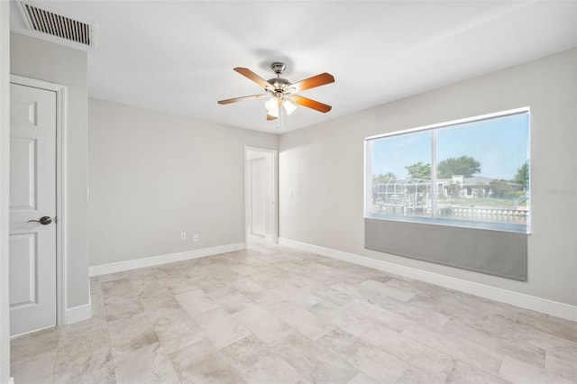3912 Doral Dr, Tampa, FL 33634 - unfurnished room featuring ceiling fan and baseboards