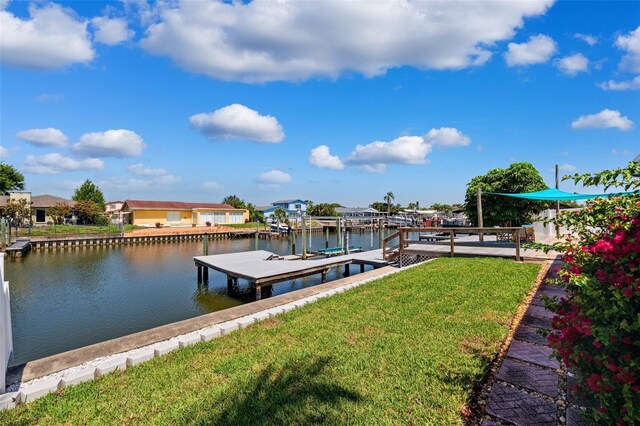 3912 Doral Dr, Tampa, FL 33634 - dock area with a water view, a lawn, and a residential view