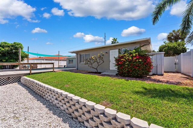 3912 Doral Dr, Tampa, FL 33634 - view of front of home with a wooden deck and stucco siding