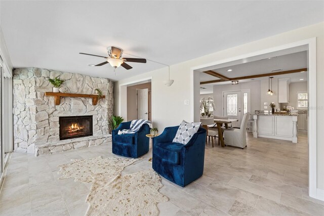 3912 Doral Dr, Tampa, FL 33634 - living area featuring a fireplace and a ceiling fan