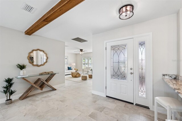 3912 Doral Dr, Tampa, FL 33634 - entryway with beamed ceiling and a ceiling fan