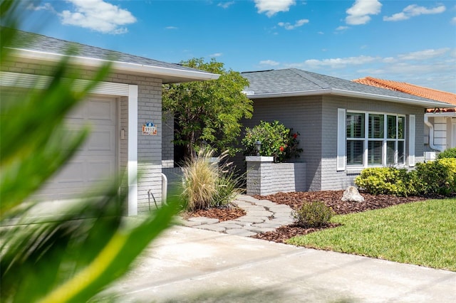 3912 Doral Dr, Tampa, FL 33634 - entrance to property featuring brick siding and a garage