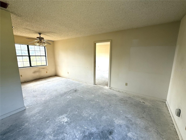 9722 Kenton Rd, Wesley Chapel, FL 33545 - spare room featuring a ceiling fan, unfinished concrete flooring, and a textured ceiling