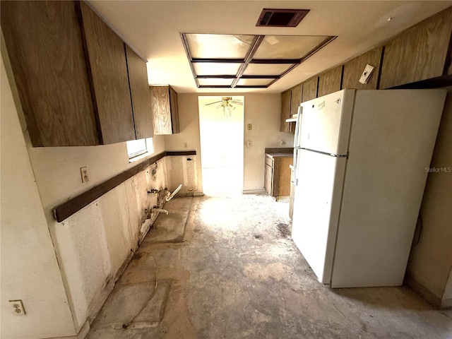 9722 Kenton Rd, Wesley Chapel, FL 33545 - kitchen with freestanding refrigerator and unfinished concrete flooring