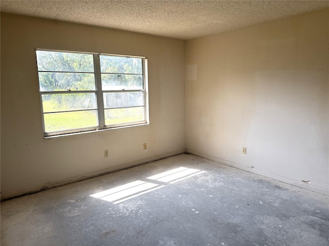 9722 Kenton Rd, Wesley Chapel, FL 33545 - empty room featuring a textured ceiling and baseboards